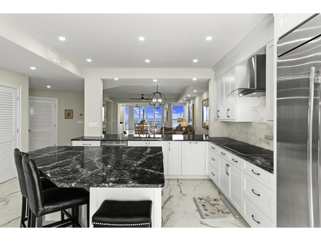 6000 Royal Marco Way 349 Condo For Sale. Kitchen and Bar featured image.